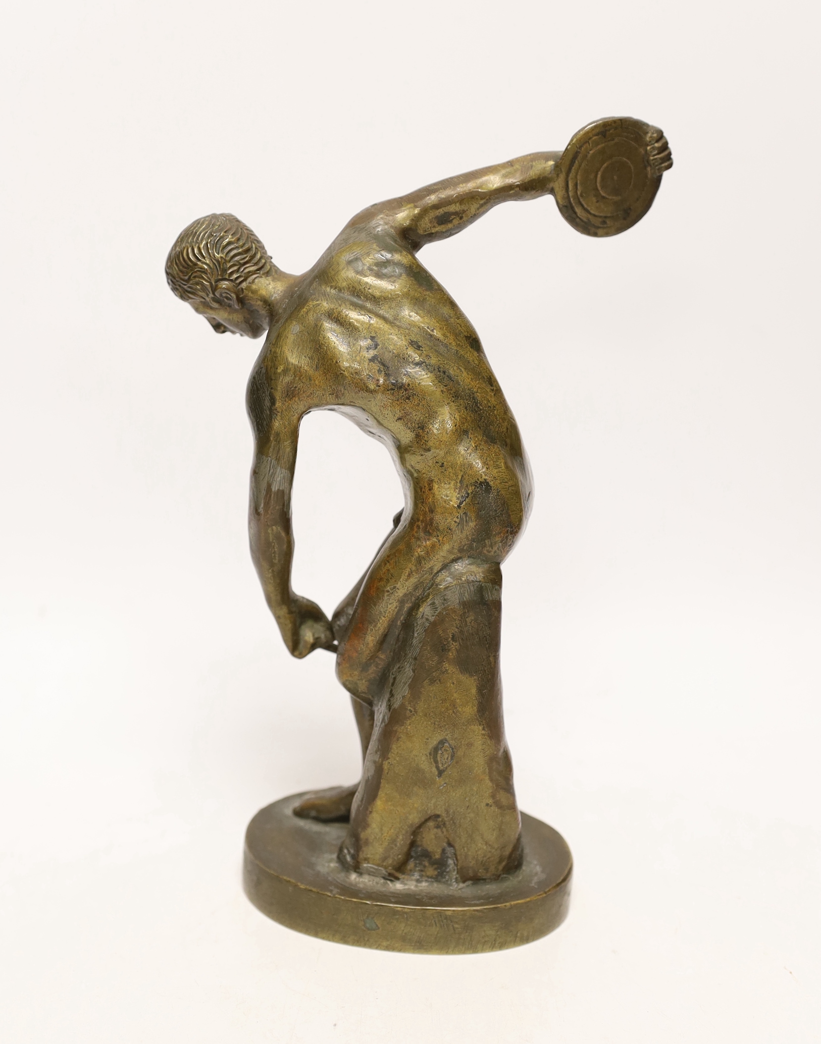 After the antique, a heavy spelter model of a discus thrower, 25cm